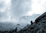 A hiker heads for the refuge of a mountain hut in Austria's Alps.